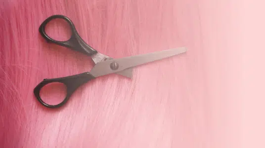 scissors cutting pink hair